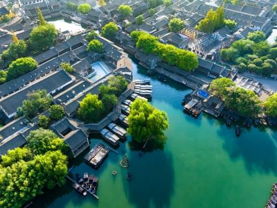 Helicopter Aerial View of Wuzhen Ancient Water Town, Emerald Canals & Classic Jiangnan Grey-Tile Buildings