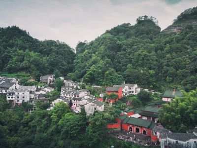 View of Qiyun Mountain, Huizhou white wall houses and red Taoist temples hidden in green mountain forests