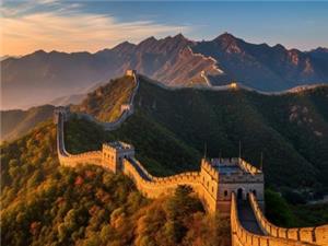 Majestic Badaling Great Wall winding over rolling mountains under beautiful sunset sky