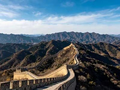 Majestic Badaling Great Wall winding over rolling mountain ridges under bright blue sky