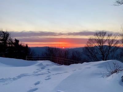 Snowy Mountain Slope With Stunning Winter Sunset Over Mountain Range Ski Resort View