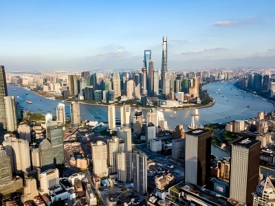 View of Shanghai Huangpu River, Lujiazui skyscrapers including Shanghai Tower, Bund historic buildings.
