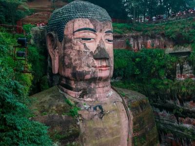 Close-up view of the head of Leshan Giant Buddha, an ancient stone statue carved into a cliff in Sichuan China