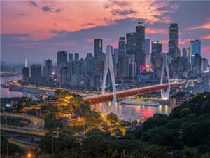 Chongqing city skyline at sunset with illuminated skyscrapers, bridges, and the Yangtze River urban landscape