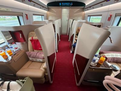 Interior of a China high-speed train business class cabin with spacious seats and comfortable travel facilities