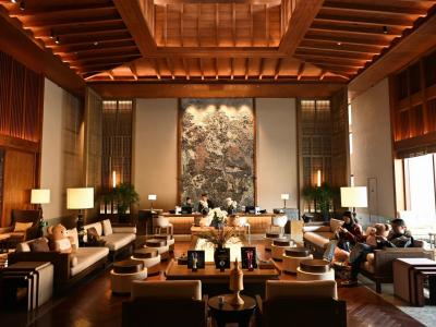 Elegant lobby interior of Conrad Jiuzhaigou Hotel luxury seating areas and traditional Chinese design elements
