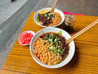 Chongqing Xiaomian noodles topped with minced meat showcasing Chongqing's famous local street food culture