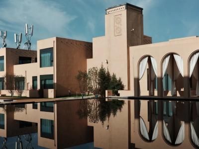 Wanda Realm Dunhuang Hotel in Gansu featuring elegant desert-inspired architecture