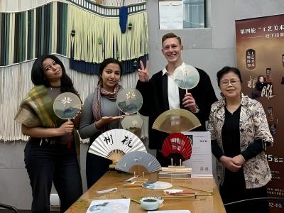 Visitors enjoying a traditional Chinese fan making workshop and cultural experience