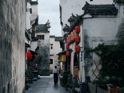 Ancient alley in Xidi Village, Huizhou style white?wall buildings with red lanterns, Huangshan