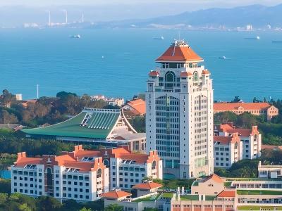 Aerial view of Xiamen coastal scenery with elegant buildings, blue sea, and a beautiful seaside landscape