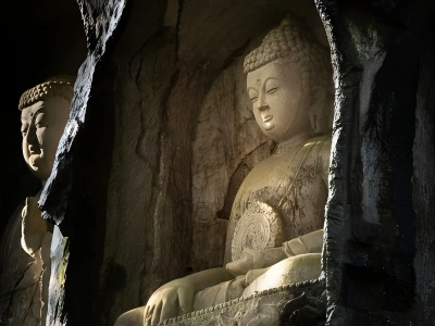 Feilai Peak in Hangzhou showing time?honored stone Buddha statues carved on mountain rock faces