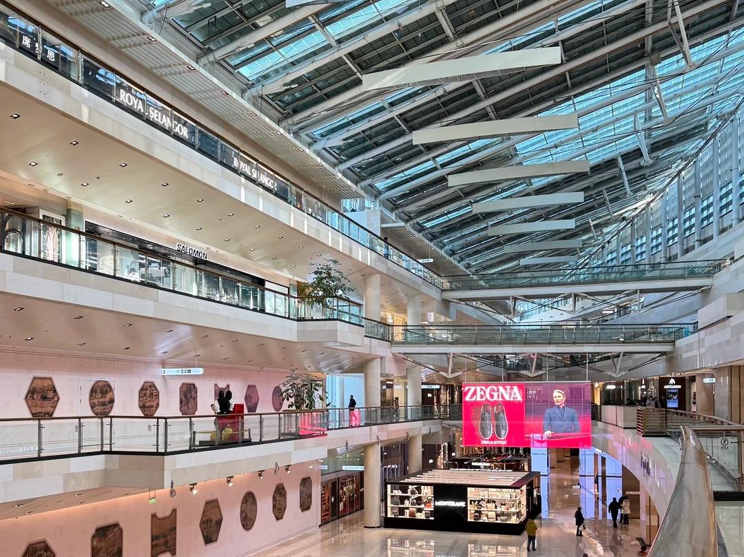 Spacious multi?level atrium inside Financial Street Shopping Center in Xidan Beijing, glass skylight roof and luxury brand stores