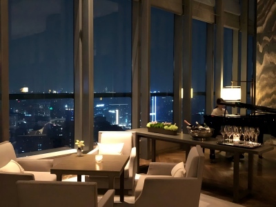 Park Hyatt Hangzhou lounge, floor-to-ceiling windows, night Qianjiang skyline & grand piano