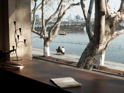 Cozy indoor window view overlooking quiet West Lake on a mild winter day