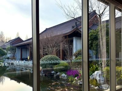 The lobby of West Lake State Guest House features a highly Eastern aesthetic