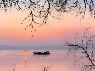 Soft Pink Sunrise over West Lake with Solitary Boat