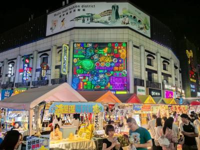 Hangzhou Wulin Road Fashion District night view with neon lights and street market