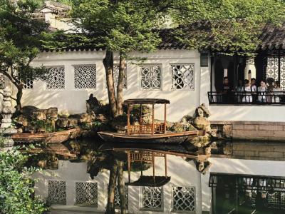 Suzhou Garden Scenery with Traditional Chinese Architecture and Pond View