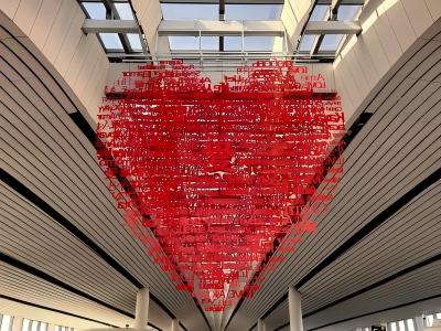 A heart made up of the spellings of love from various countries is displayed at Beijing Daxing Airport
